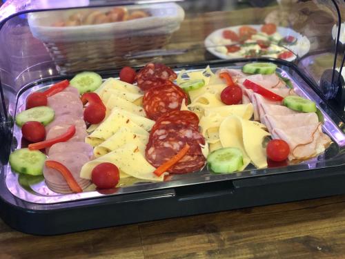 a plastic tray filled with different types of food at Penzion Farma Žleby in České Žleby
