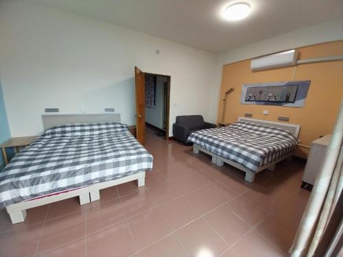 Ένα ή περισσότερα κρεβάτια σε δωμάτιο στο Gigia Homestay