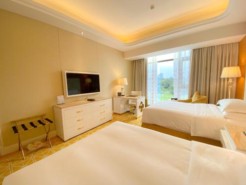 TV a/nebo společenská místnost v ubytování Continental Xin Hao Hotel and Resort 洲际新濠酒店