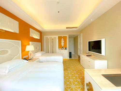 TV a/nebo společenská místnost v ubytování Continental Xin Hao Hotel and Resort 洲际新濠酒店