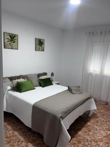 Ένα ή περισσότερα κρεβάτια σε δωμάτιο στο Apartamentos custodio