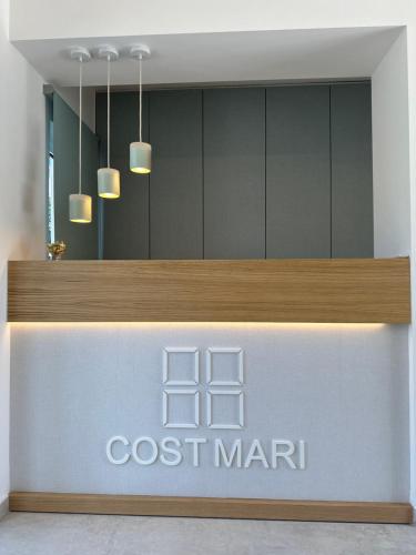 un frente de tienda con un letrero marin de coste y luces en Cost Mari Almyrida New by ZAGO Boutiqe hotels, en Almyrida