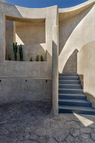 a staircase in a building with a stair case at Senses Luxury Houses in Fira