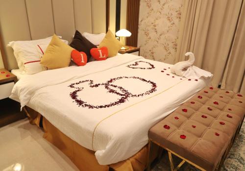 a bed with a heart drawn on it at سما الرفاع 3 in Al Kharj