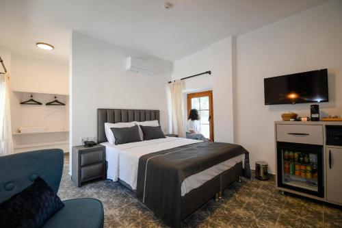Ένα ή περισσότερα κρεβάτια σε δωμάτιο στο Swan Boutique Hotel