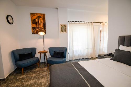 Ένα ή περισσότερα κρεβάτια σε δωμάτιο στο Swan Boutique Hotel