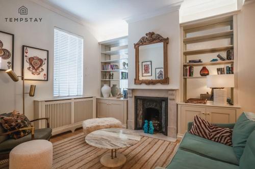 a living room with a couch and a fireplace at The Long Walk: 3Bed & Garden in Windsor