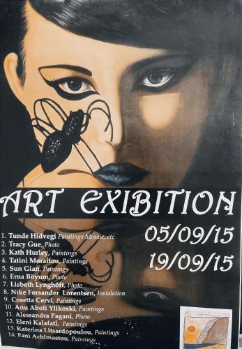 a poster for a painting of a woman with a butterfly at Arcadia Guesthouse in Eresos