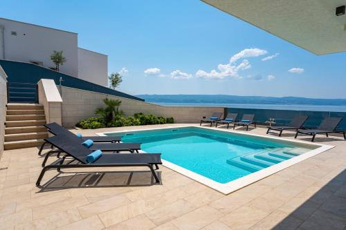 Luxury, seafront Villa Petra with heated pool only 50m from beach