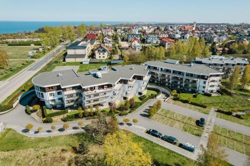 an aerial view of an apartment complex with a street at BlueApart Apartamenty Na Klifie in Władysławowo
