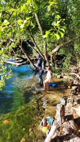 a man and a woman standing in a river at Kuca za odmor Una-Mia in Kulen Vakuf