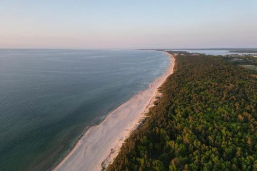 an aerial view of a beach and the ocean at Seaside Escape Pet Friendly Apartments Mielenko by Noclegi Renters in Mielenko