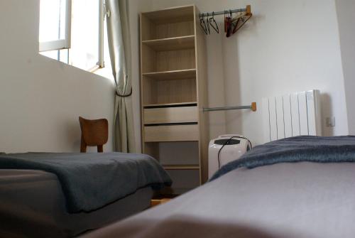 Ένα ή περισσότερα κρεβάτια σε δωμάτιο στο Gîte de Beaugu