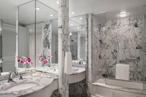 a bathroom with two sinks and a large mirror at The Ritz-Carlton, Laguna Niguel in Dana Point
