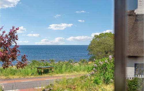a view of the ocean from a window at Awesome Home In Svaneke With Wifi in Svaneke