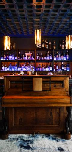 a bar with a lot of bottles of alcohol at Quintessia in Orvault