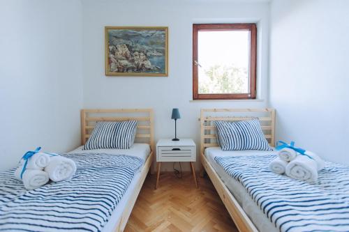 Posteľ alebo postele v izbe v ubytovaní Hello Crikvenica Apartment