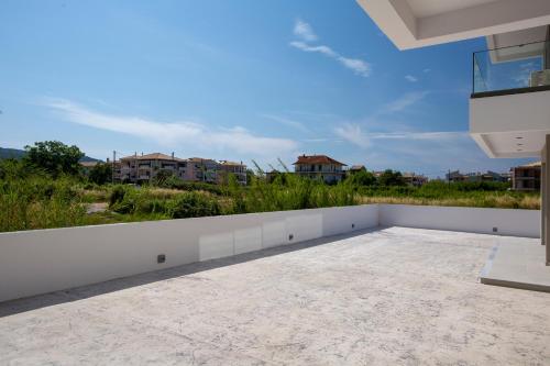 a view from the balcony of a house at Achillion Suites in Lefkada Town