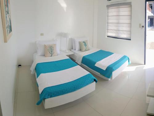 Katil atau katil-katil dalam bilik di Blue Coast Beach Hotel