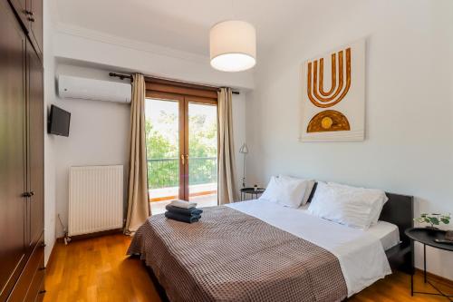 Ein Bett oder Betten in einem Zimmer der Unterkunft Villa Acropolis Serres With Parking Next to Center