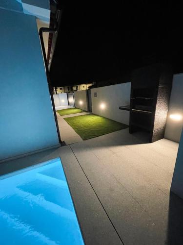 a view of a swimming pool at night at House 9 Guimarães in Guimarães