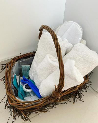 a basket filled with towels and other items at Ardbrin Lodge in Dunadry