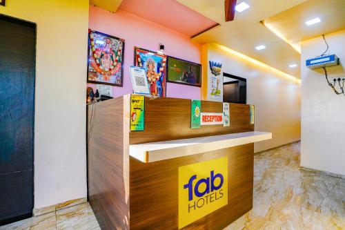 a lobo hotel lobby with a reception desk at FabHotel Tanishq in Sinnar