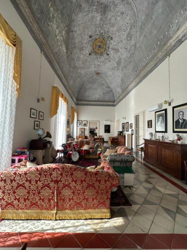 a living room with a couch and a ceiling at La Dimora Del Barone in Vernole
