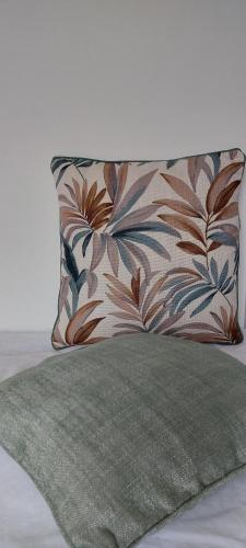 a pillow sitting on top of a bed with a blanket at Valelyhouse in Rome