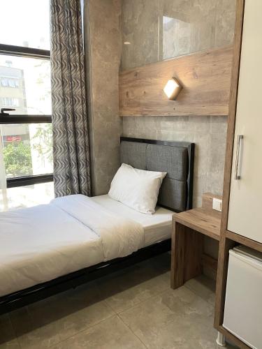Letto o letti in una camera di M-ODA OTEL