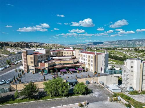 an aerial view of a city with buildings at Ramada By Wyndham Cappadocia in Ortahisar