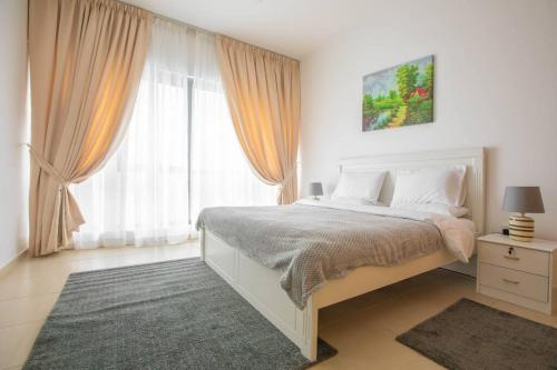 a bedroom with a bed and a large window at GREAT 3 Bedroom Apartment Beach Front (Side View) in Abu Dhabi
