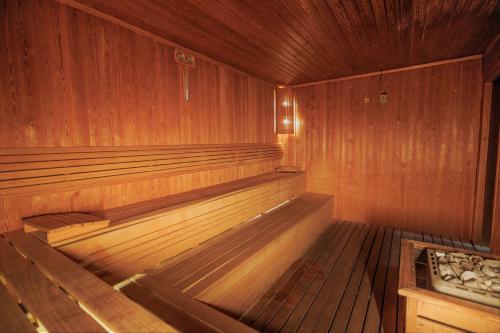 an empty sauna with wooden walls and wooden floors at Ramada By Wyndham Cappadocia in Ortahisar