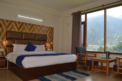 En eller flere senger på et rom på Hotel Neha Regency