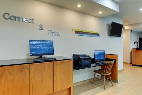 an office with a desk with a computer on it at Fairfield Inn & Suites by Marriott Fort Worth I-30 West Near NAS JRB in Fort Worth