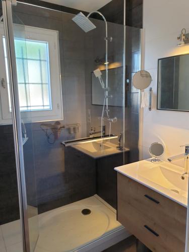 a bathroom with a shower and a sink at LA ROCHELLE classé 3 étoiles in Nieul-sur-Mer