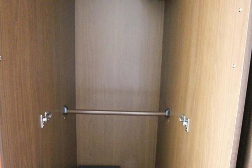 a bathroom with two towel racks on the wall at 志摩の別荘 in Shima