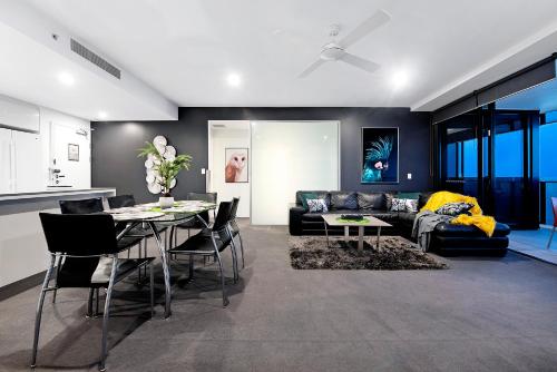 a living room with a couch and a table at Circle on Cavill - Self Contained & Privately Managed - Wow Stay in Gold Coast