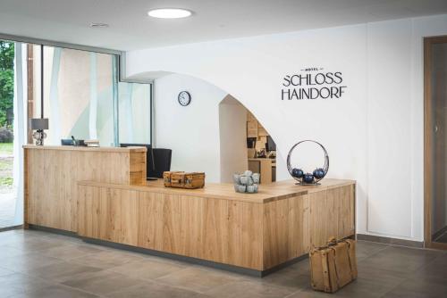 a shop with a wooden counter with a sign that reads successkward at Schloss Haindorf in Langenlois