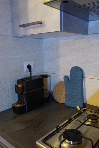 a kitchen with a stove and a stove top oven at SAILA Monolocale SATURNO in Attigliano