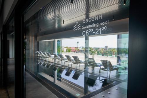 a window of a waiting room with chairs in it at WHITE HILLS HOTEL spa&sport in Uzhhorod