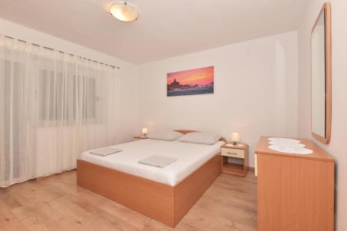 Postel nebo postele na pokoji v ubytování Apartments Vjeko