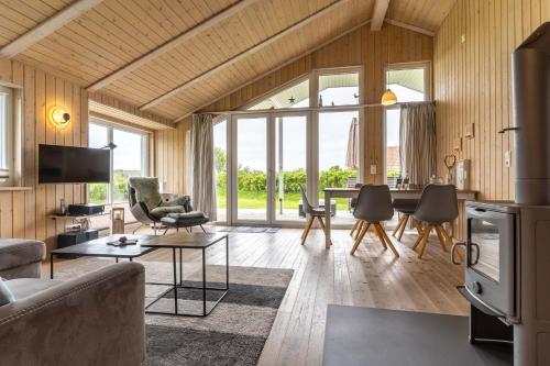 a living room with a couch and a table at Nordseenest am Deich in Wesselburenerkoog