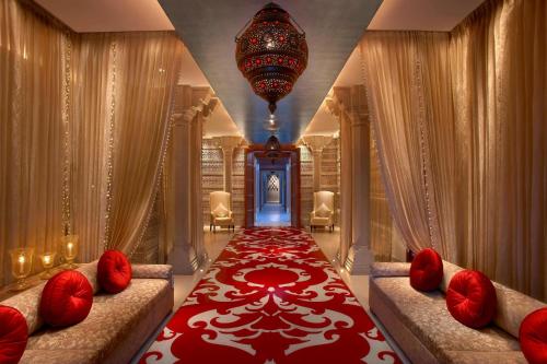 a hallway with two couches and a red carpet at ITC Mughal, A Luxury Collection Resort & Spa, Agra in Agra
