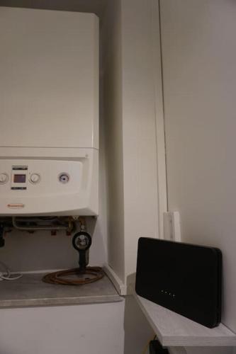 a television sitting on a shelf in a room at SAILA Monolocale VENERE in Attigliano