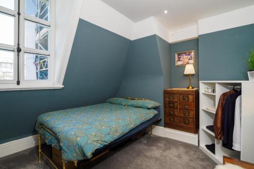a bedroom with a bed and a window at Pearl Chambers in Leeds City Centre in Leeds