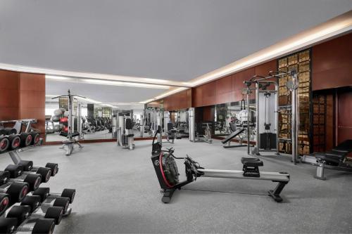 a fitness room with a gym with tread machines at Sheraton Hai Phong in Hai Phong