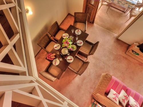 an overhead view of a dining table and chairs at Villa Ibiscus in Las Galeras