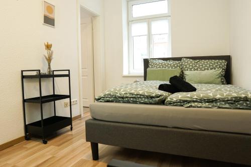 Krevet ili kreveti u jedinici u okviru objekta HOMY I Gemütliches Apartment Gohlis Netflix und W-LAN