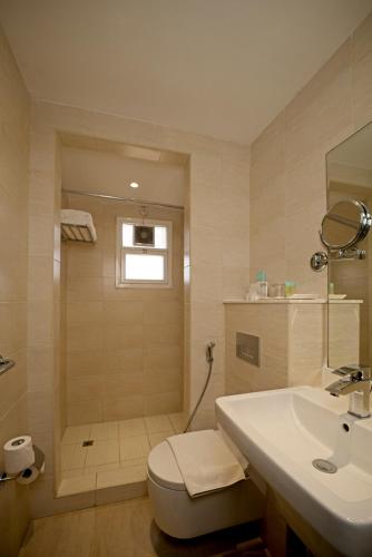  Action Hotel Ras Al Khaimah -  Room  picture :   Tea/Coffee maker    Minibar    Shower                           